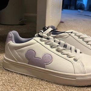 Purple & white Mickey tennis shoes.